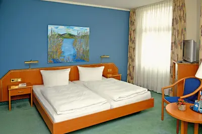 Ein Bett oder Betten in einem Zimmer der Unterkunft Hotel Kaiserhof