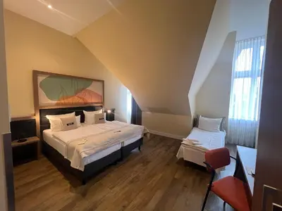 Ein Bett oder Betten in einem Zimmer der Unterkunft Garner Hotel Berlin - Charlottenburg, an IHG Hotel