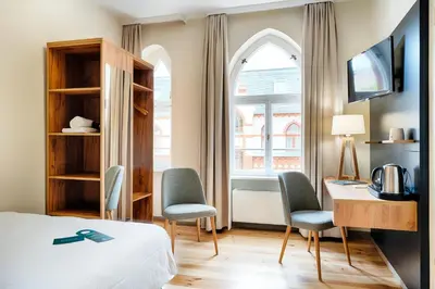 Ein Bett oder Betten in einem Zimmer der Unterkunft martas Hotel Berlin-Mitte