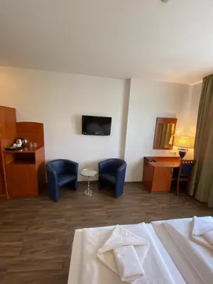 Ein Bett oder Betten in einem Zimmer der Unterkunft Hotel Atrium Charlottenburg