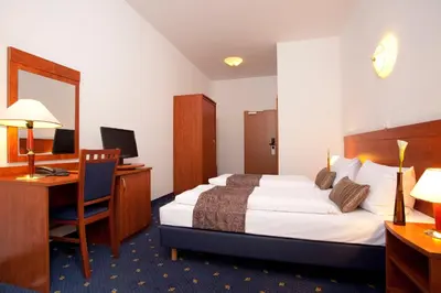 Ein Bett oder Betten in einem Zimmer der Unterkunft Hotel Atrium Charlottenburg