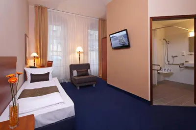 Ein Bett oder Betten in einem Zimmer der Unterkunft Hotel Atrium Charlottenburg