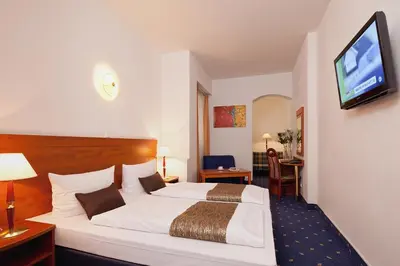 Ein Bett oder Betten in einem Zimmer der Unterkunft Hotel Atrium Charlottenburg