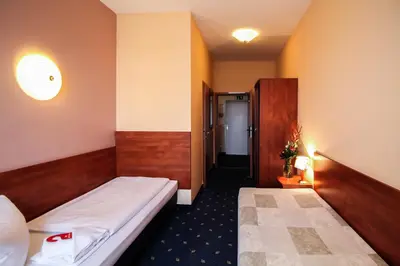 Ein Bett oder Betten in einem Zimmer der Unterkunft Hotel Atrium Charlottenburg