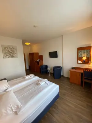 Ein Bett oder Betten in einem Zimmer der Unterkunft Hotel Atrium Charlottenburg