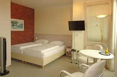 Ein Bett oder Betten in einem Zimmer der Unterkunft Hotel St.-Michaels-Heim