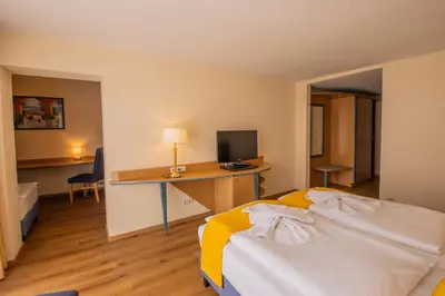 Ein Bett oder Betten in einem Zimmer der Unterkunft Seehotel Bollmannsruh