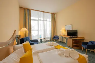 Ein Bett oder Betten in einem Zimmer der Unterkunft Seehotel Bollmannsruh