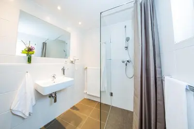 Ein Badezimmer in der Unterkunft fjord hotel berlin