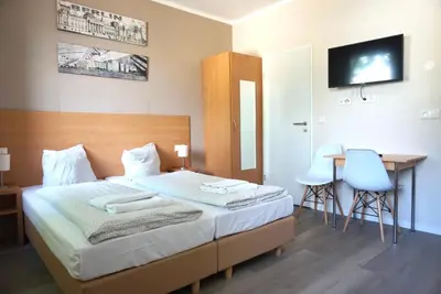 Ein Bett oder Betten in einem Zimmer der Unterkunft Apartment Hotel Wittenau