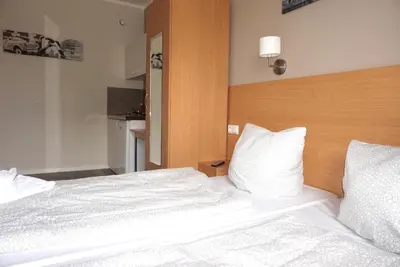 Ein Bett oder Betten in einem Zimmer der Unterkunft Apartment Hotel Wittenau