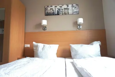 Ein Bett oder Betten in einem Zimmer der Unterkunft Apartment Hotel Wittenau
