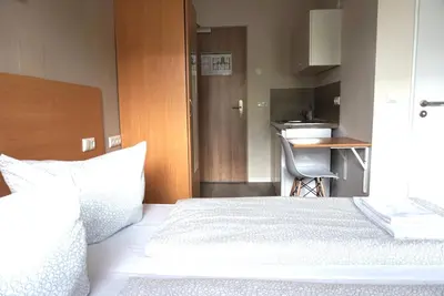 Ein Bett oder Betten in einem Zimmer der Unterkunft Apartment Hotel Wittenau