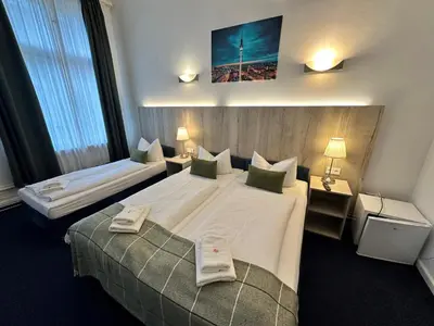 Ein Bett oder Betten in einem Zimmer der Unterkunft Hotel Seifert Berlin am Kurfürstendamm