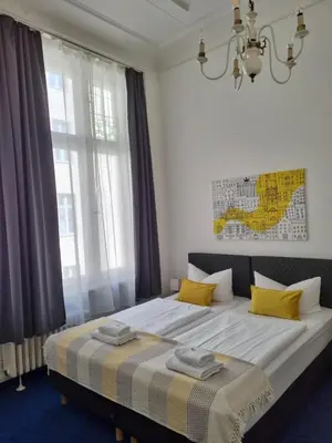 Ein Bett oder Betten in einem Zimmer der Unterkunft Hotel Seifert Berlin am Kurfürstendamm