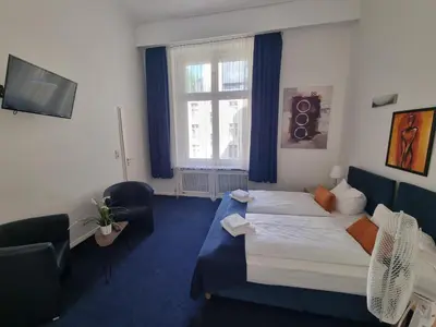 Ein Bett oder Betten in einem Zimmer der Unterkunft Hotel Seifert Berlin am Kurfürstendamm