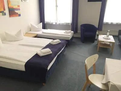 Ein Bett oder Betten in einem Zimmer der Unterkunft Hotel Seifert Berlin am Kurfürstendamm