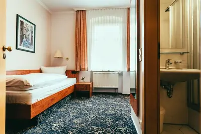 Ein Bett oder Betten in einem Zimmer der Unterkunft Landhotel Classic