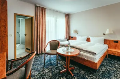 Ein Bett oder Betten in einem Zimmer der Unterkunft Landhotel Classic