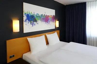 Ein Bett oder Betten in einem Zimmer der Unterkunft greet Hotel Potsdam am Park Sanssouci