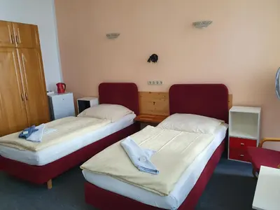 Ein Bett oder Betten in einem Zimmer der Unterkunft Pension zum Lichtenberger