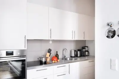 Küche/Küchenzeile in der Unterkunft SC 05 by ROCKCHAIR Apartments l SUPERHOST Status l 2 Bedrooms Boxspringbeds Balcony Elevator - Cozy Family & Business Flair welcomes you!