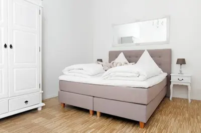 Ein Bett oder Betten in einem Zimmer der Unterkunft SC 06 by ROCKCHAIR Apartments l SUPERHOST Status l 4 Bedrooms Boxspringbeds 2 Bathrooms Balcony Elevator - Cozy Family & Business Flair welcomes you!