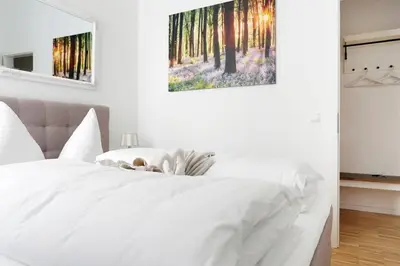 Ein Bett oder Betten in einem Zimmer der Unterkunft SC 06 by ROCKCHAIR Apartments l SUPERHOST Status l 4 Bedrooms Boxspringbeds 2 Bathrooms Balcony Elevator - Cozy Family & Business Flair welcomes you!