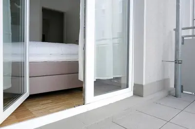 Ein Bett oder Betten in einem Zimmer der Unterkunft SC 06 by ROCKCHAIR Apartments l SUPERHOST Status l 4 Bedrooms Boxspringbeds 2 Bathrooms Balcony Elevator - Cozy Family & Business Flair welcomes you!