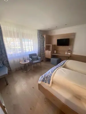 Ein Bett oder Betten in einem Zimmer der Unterkunft Hotel Falkenseer Hof