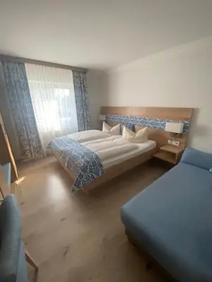 Ein Bett oder Betten in einem Zimmer der Unterkunft Hotel Falkenseer Hof
