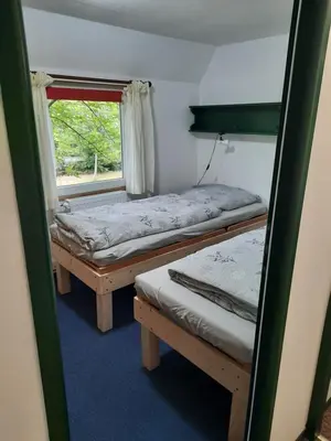 Ein Bett oder Betten in einem Zimmer der Unterkunft Ferienhaus Eichenblatt