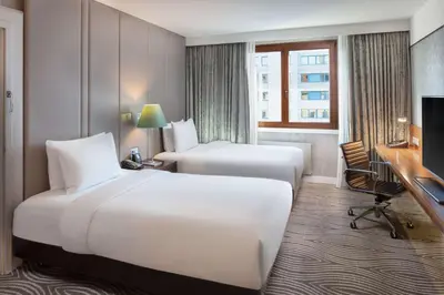 Ein Bett oder Betten in einem Zimmer der Unterkunft Hilton Berlin