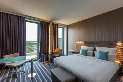 Ein Bett oder Betten in einem Zimmer der Unterkunft Steigenberger Airport Hotel Berlin