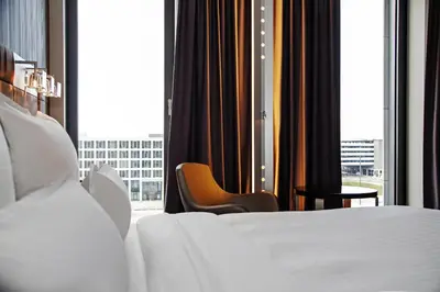 Ein Bett oder Betten in einem Zimmer der Unterkunft Steigenberger Airport Hotel Berlin