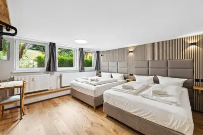 Ein Bett oder Betten in einem Zimmer der Unterkunft Hotel Comenius