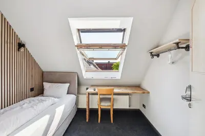 Ein Bett oder Betten in einem Zimmer der Unterkunft Hotel Comenius