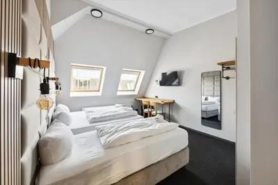 Ein Bett oder Betten in einem Zimmer der Unterkunft Hotel Comenius
