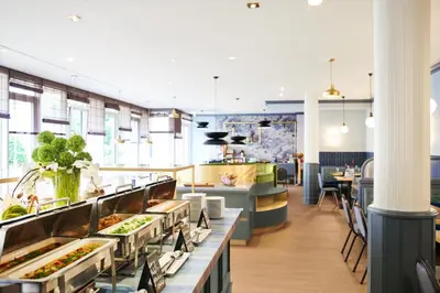Ein Restaurant oder anderes Speiselokal in der Unterkunft MAXX Hotel Sanssouci Potsdam