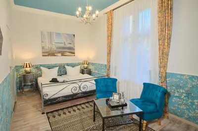 Ein Bett oder Betten in einem Zimmer der Unterkunft Anno 1900 Hotel Babelsberg