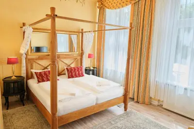 Ein Bett oder Betten in einem Zimmer der Unterkunft Anno 1900 Hotel Babelsberg
