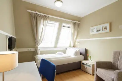 Ein Bett oder Betten in einem Zimmer der Unterkunft Hotel Pankow