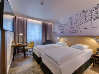 Ein Bett oder Betten in einem Zimmer der Unterkunft Mercure Hotel Berlin City