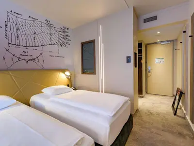 Ein Bett oder Betten in einem Zimmer der Unterkunft Mercure Hotel Berlin City