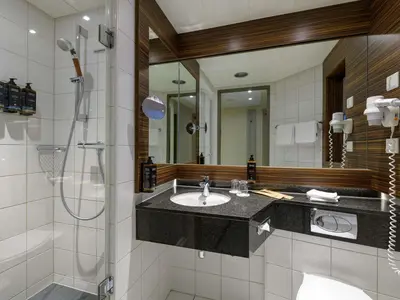 Ein Badezimmer in der Unterkunft Mercure Hotel Berlin City