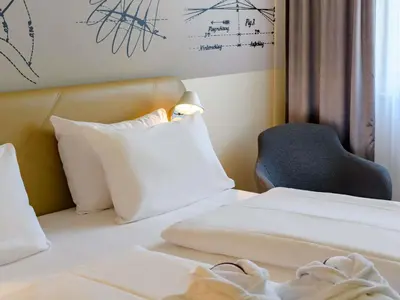 Ein Bett oder Betten in einem Zimmer der Unterkunft Mercure Hotel Berlin City
