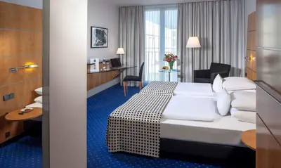 Ein Bett oder Betten in einem Zimmer der Unterkunft Dorint Hotel Potsdam