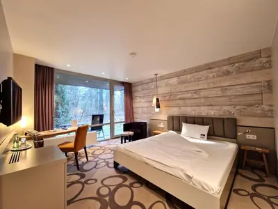 Ein Bett oder Betten in einem Zimmer der Unterkunft Ringhotel Schorfheide I Waldresort Werbellinsee