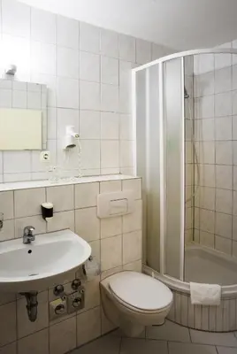 Ein Badezimmer in der Unterkunft Hotel Aster an der Messe