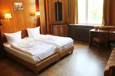 Ein Bett oder Betten in einem Zimmer der Unterkunft Hotel Aster an der Messe